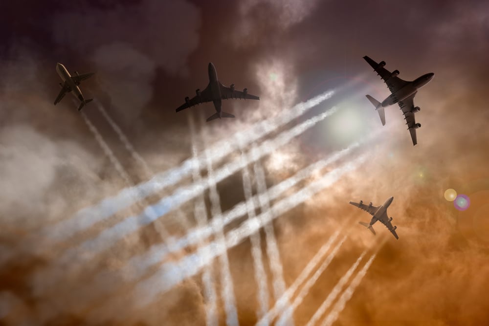 Airplanes,Fly,Against,A,Dramatic,Sky,,Leaving,Contrails
